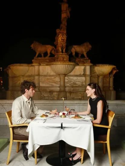 Couple dining in the palace garden at Cairo Marriott