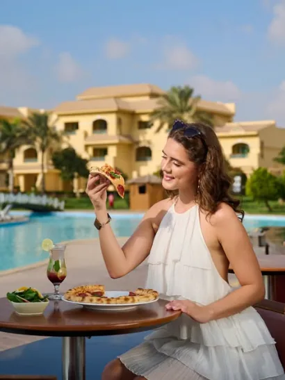 Woman by the pool at Mövenpick Cairo Media City